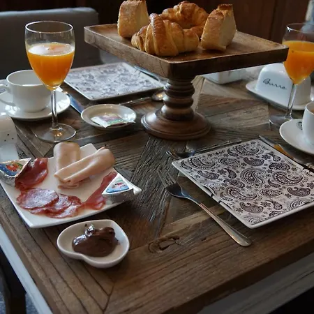 Quatre Saisons Frühstückspension